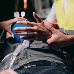 FirstAidPro holding hand delivers CPR