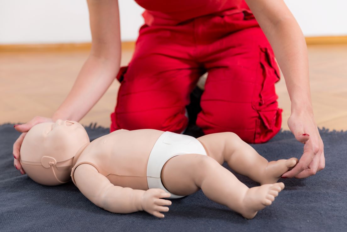 CPR training on an infant
