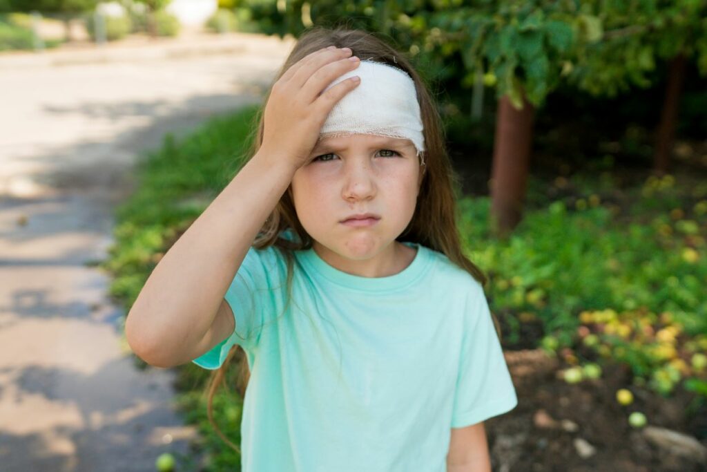 girl with bandage on head from sports injury