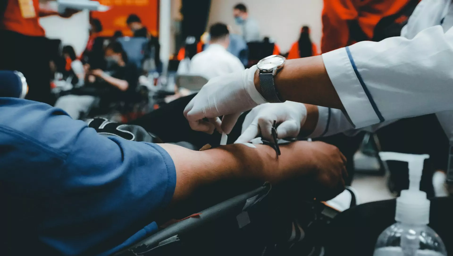 A person getting their blood drawn by a doctor for medical purposes.