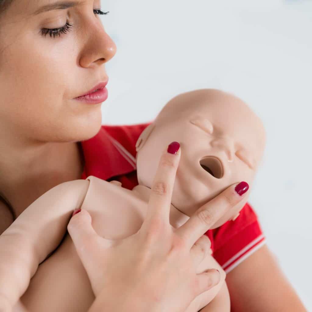 choking first aid - demonstrated on infant manikin
