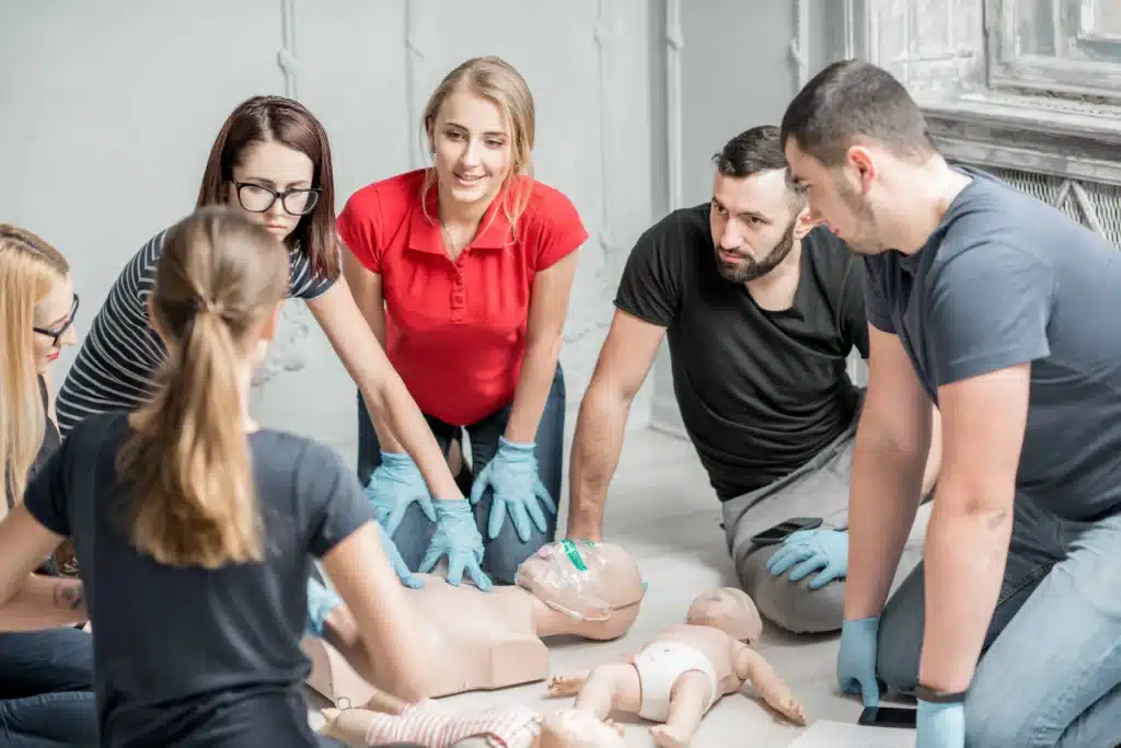 Sydney participants practicing CPR skills under instructor&rsquo;s guidance first aid skills