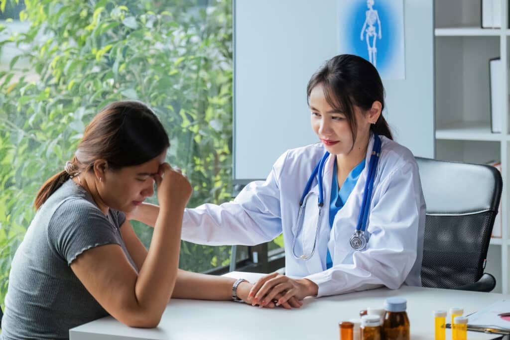 Doctor holding hands and patient empathy, healthcare or medical trust, hope and faith in therapy, healing and rehabilitation in mental health consulting