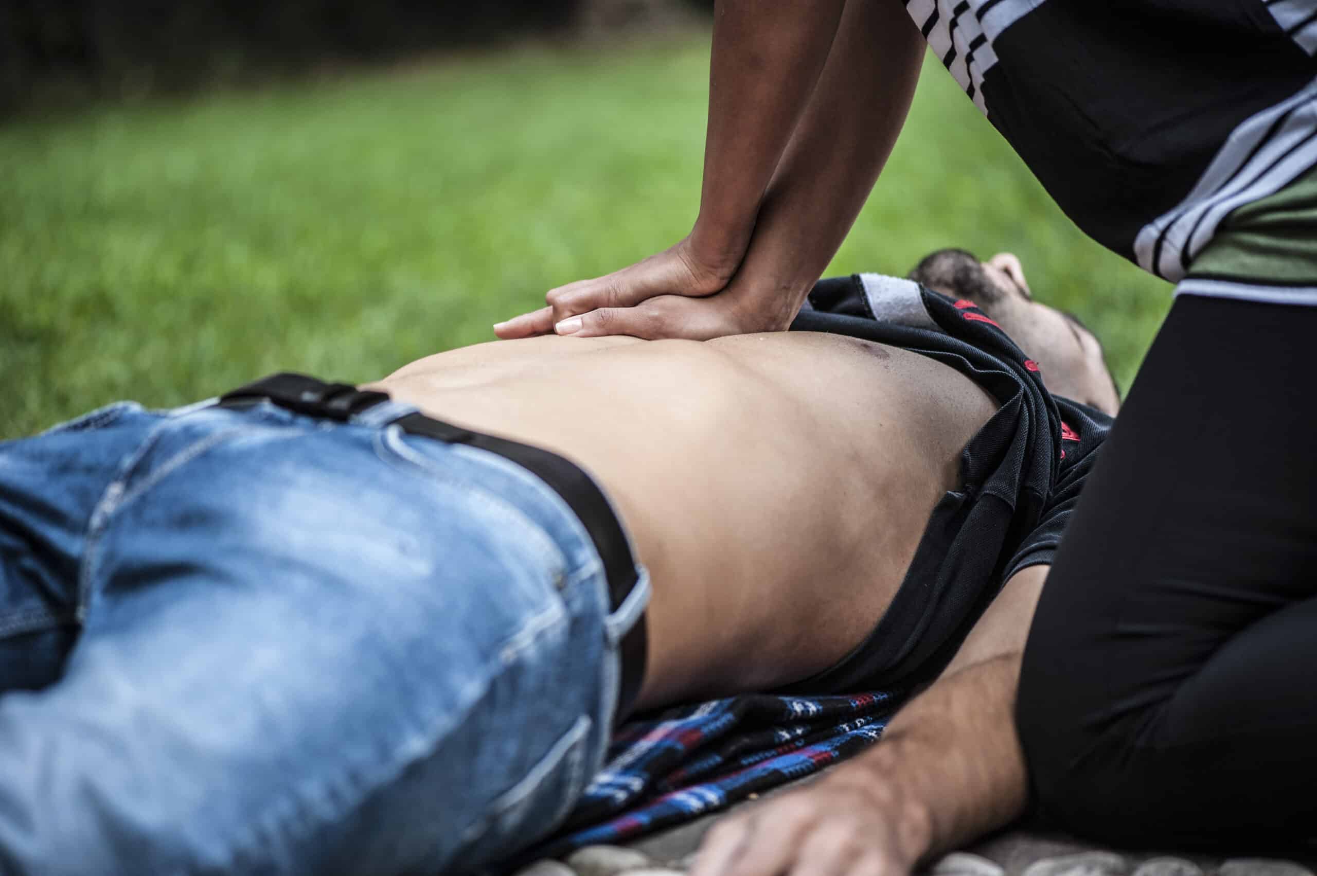 First Aid skills are vital -girl-helping-an-unconscious-guy-with-CPR