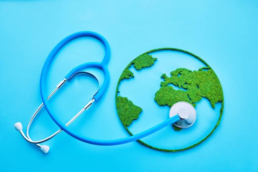 World Health Day. Global Health Awareness Concept. Globe and Stethoscope on blue background