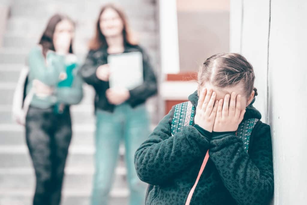 Panic attack - disorder - Girl being bullied at the school. Educational school isolation and bullying concept.