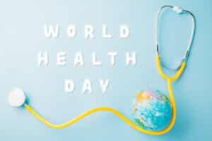 World Health Day. Yellow doctor stethoscope and world globe isolated on blue background, Save world day, Green Earth, Healthcare and medical concept
