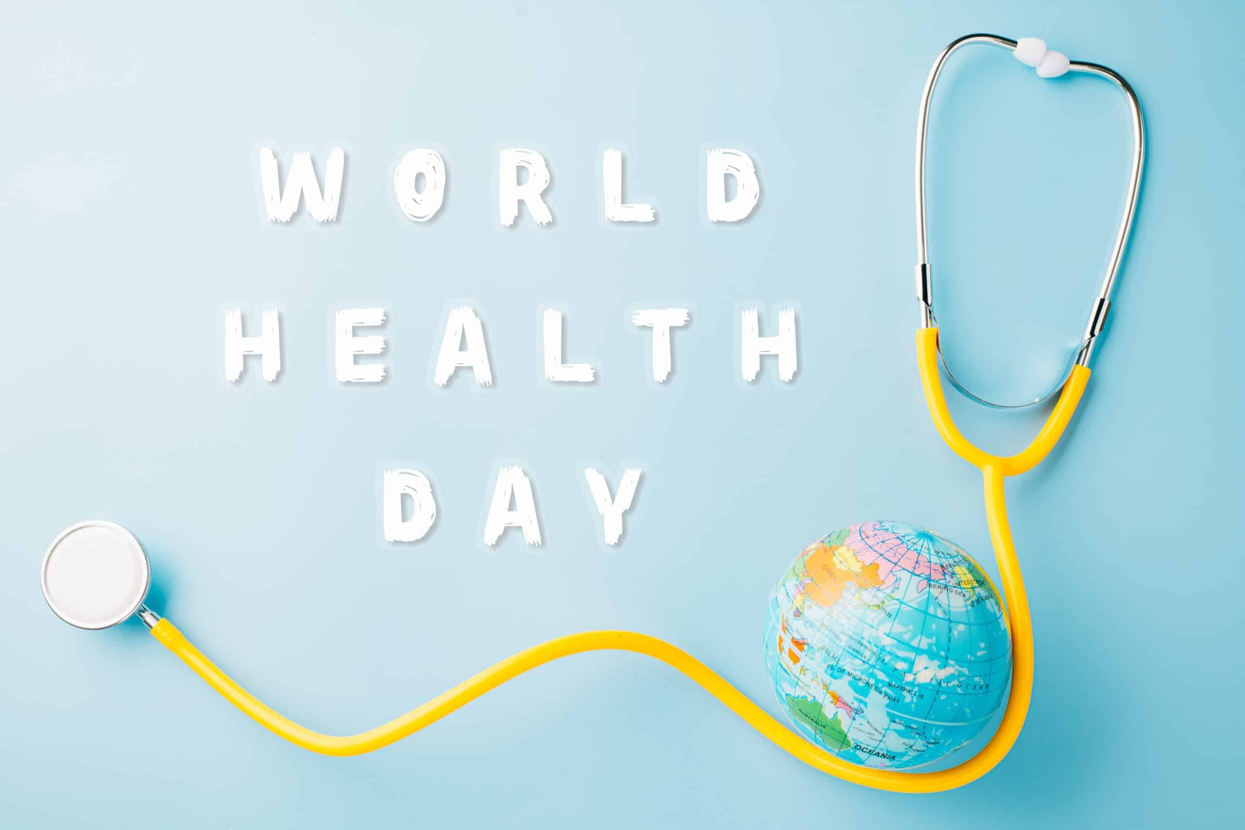 World Health Day. Yellow doctor stethoscope and world globe isolated on blue background, Save world day, Green Earth, Healthcare and medical concept