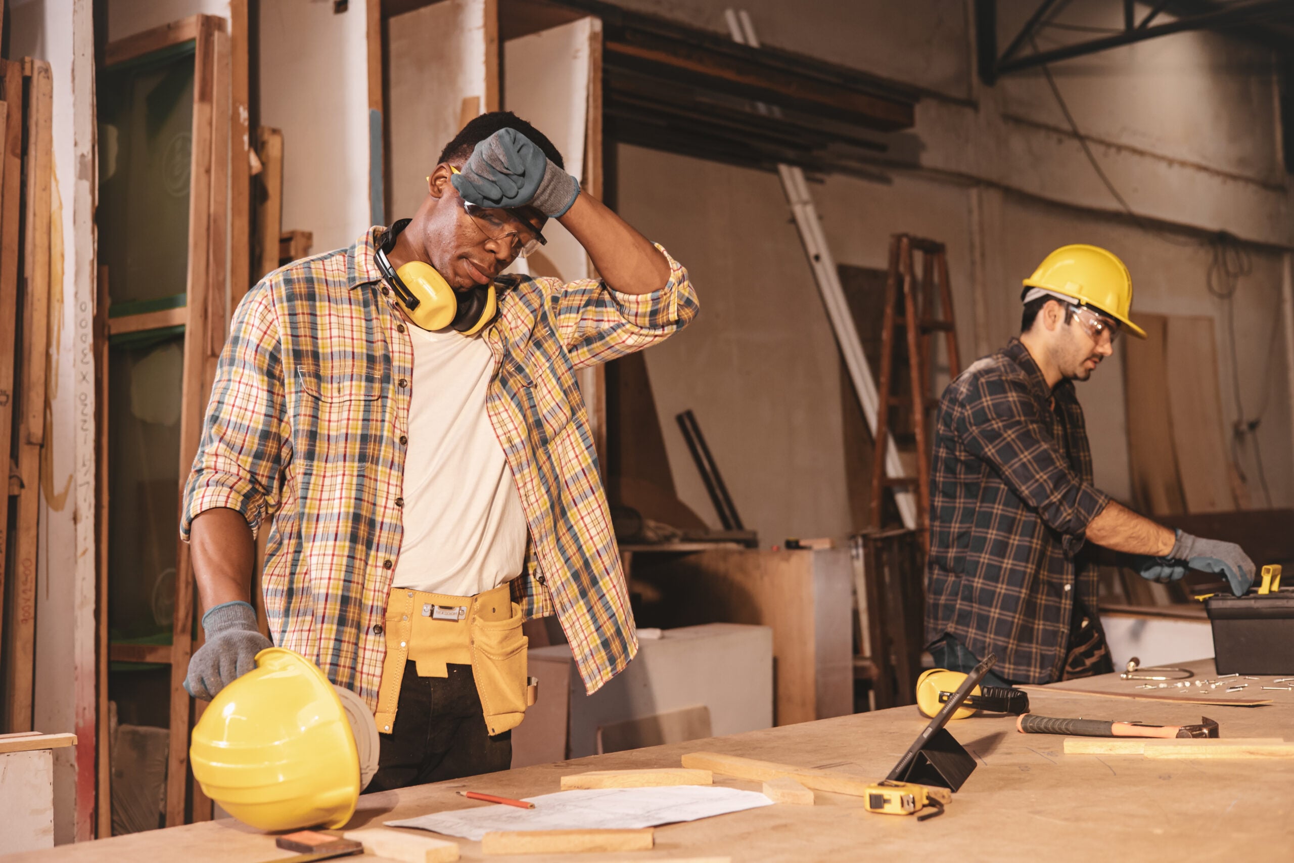 Tradies National Health Month 2026 - tired fatigue hard work worker in wood workshop factory sweating hot weather