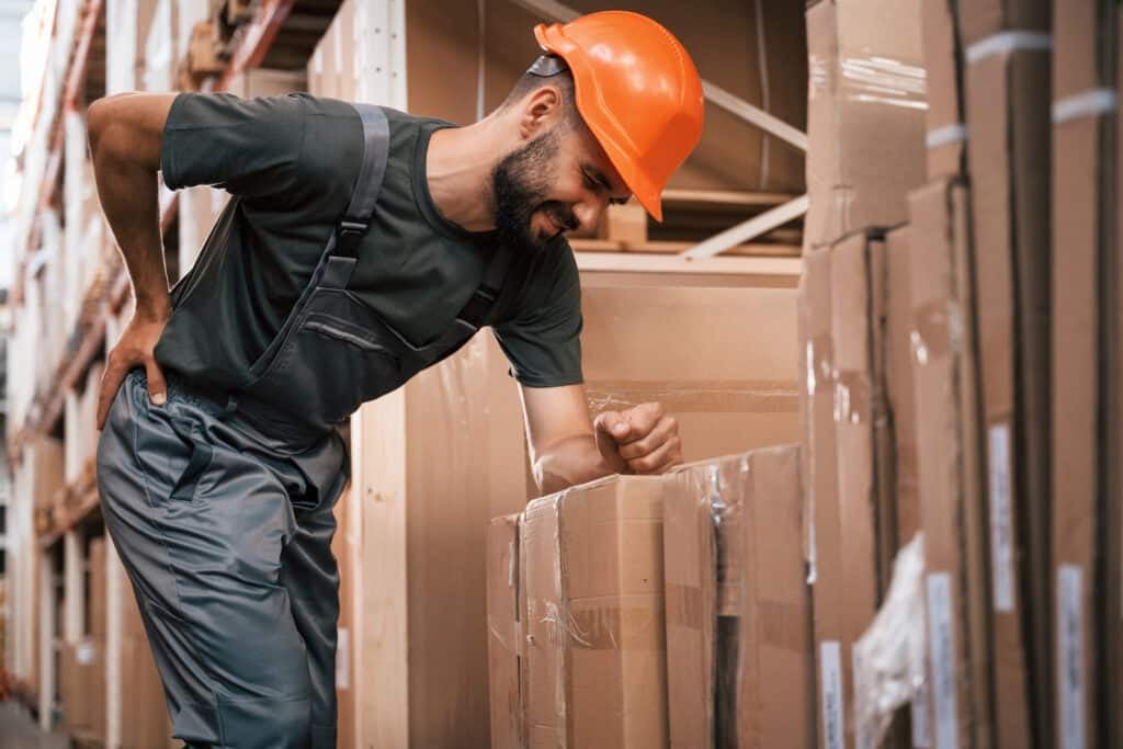 Back is hurting, spine pain. Foreman is in the storehouse, shipping distribution business.