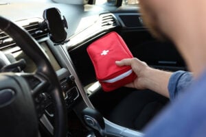 National Tradesmen Day - Tradesman with first aid kit inside van, closeup